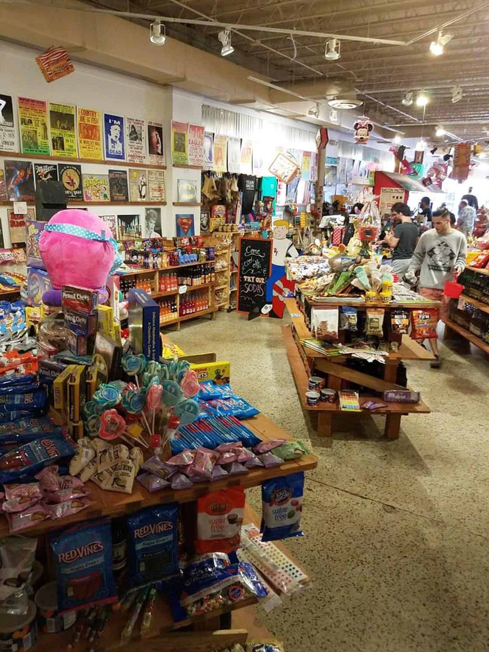 Colorful thrift store packed with vintage books, toys, and unique gifts, popular for secondhand treasures.