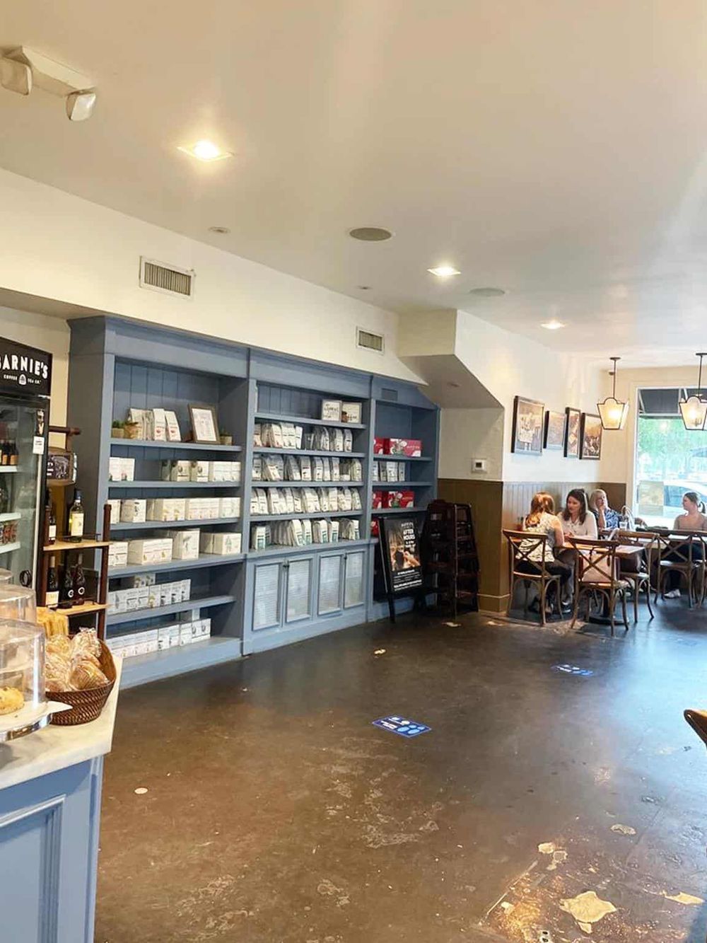 Assorted coffee and tea supplies in a cozy cafe setting for perfect breakfast or coffee break.