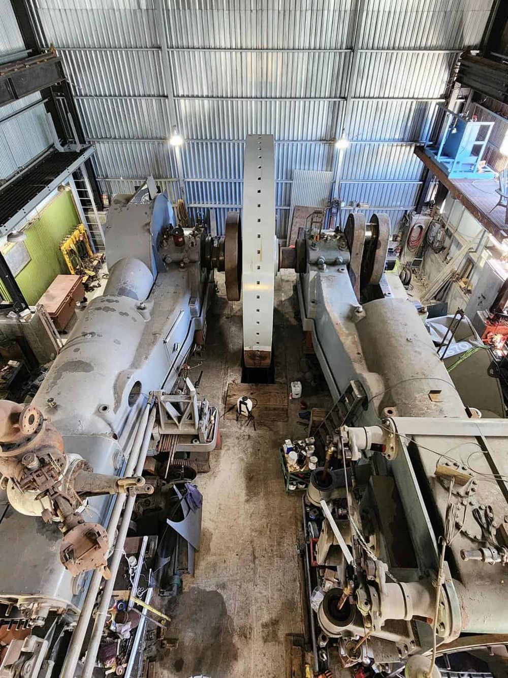 Heavy industrial machinery in a workshop for industrial equipment repair and maintenance.