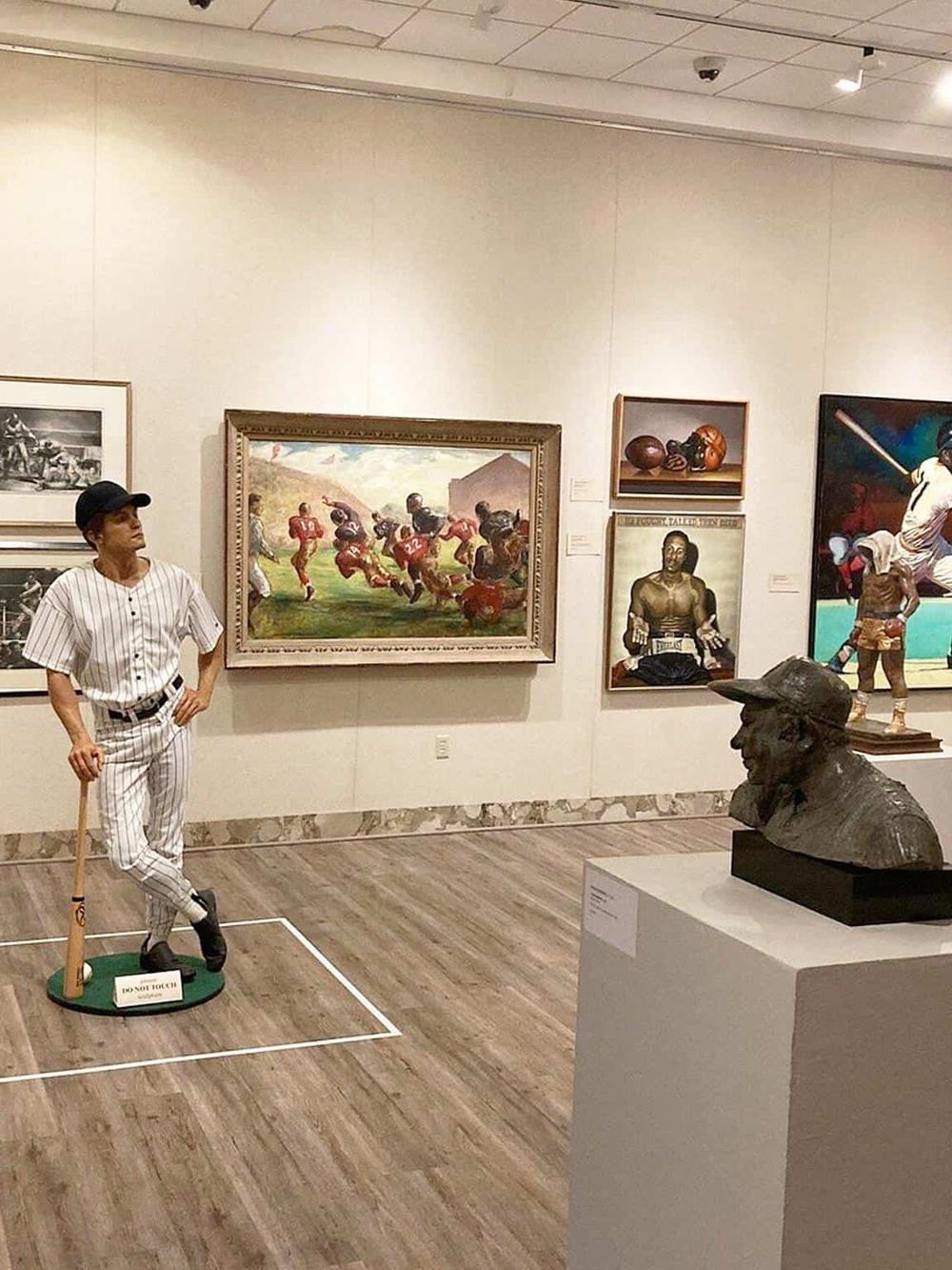 Colorful sports-themed art gallery showcasing American sports history at QuestForDirections museum.