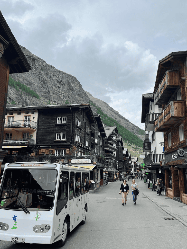 Charming mountain village with wooden buildings and scenic views, perfect for tourism and exploration.