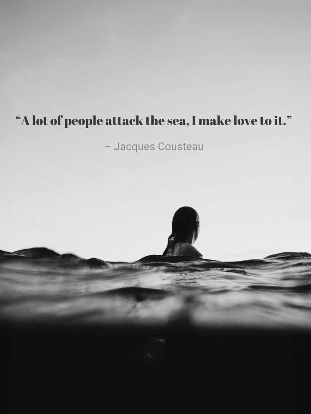 A person swimming in the sea with a quote about the love for the ocean.