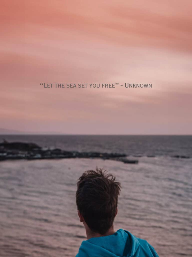 Serene ocean view at sunset with a person gazing, inspiring travel and adventure with Quest For Directions.