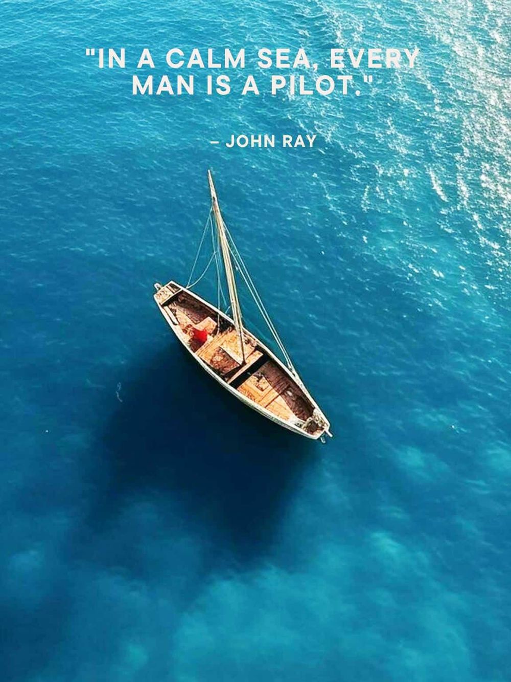 Serene sailboat on calm ocean with inspirational quote about adventure and navigation.