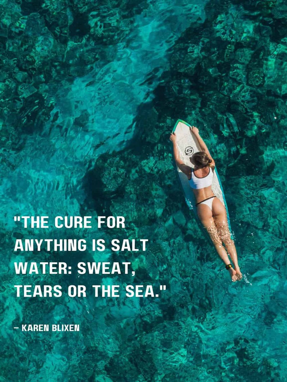 Vibrant woman paddleboarding over clear turquoise water, promoting adventure and outdoor exploration.