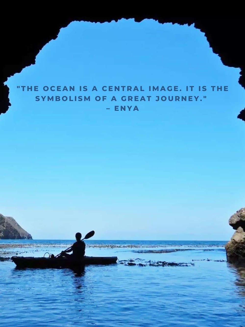 Vast ocean viewed from a cave opening with a kayaker, perfect for adventure and travel SEO keywords.