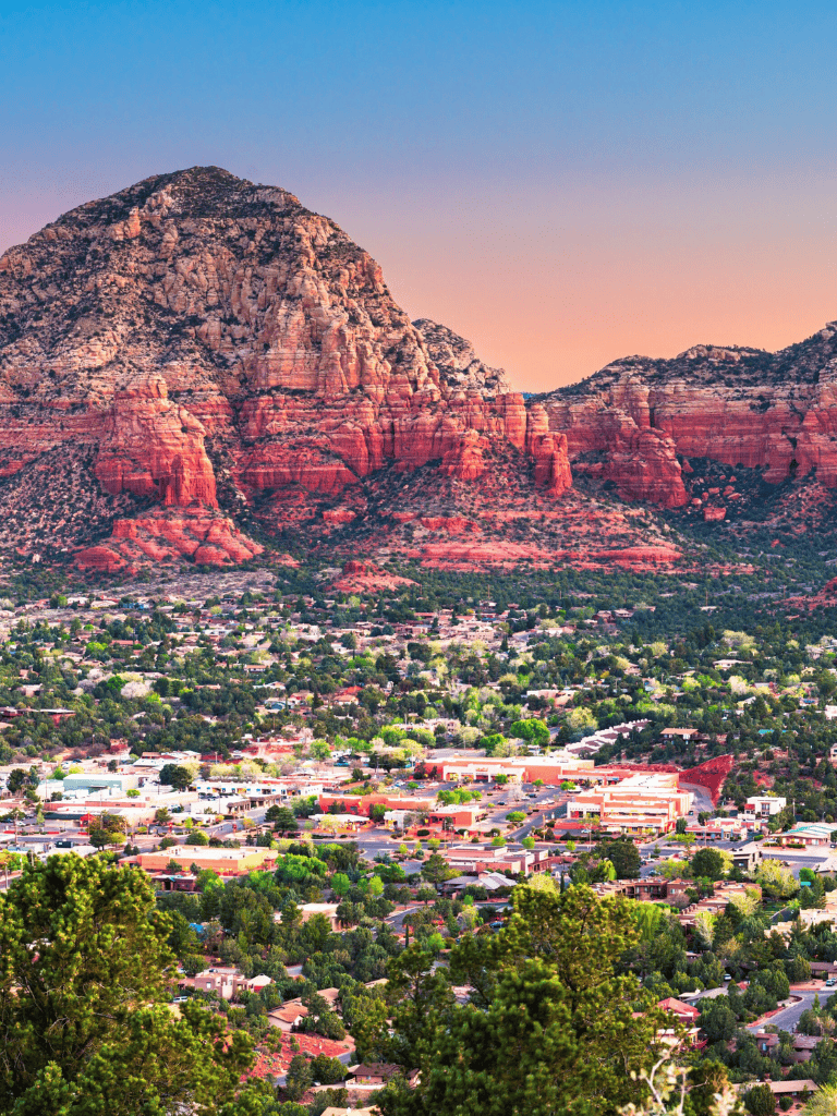 Red Rock formations and desert landscape in Sedona, Arizona, during sunset.