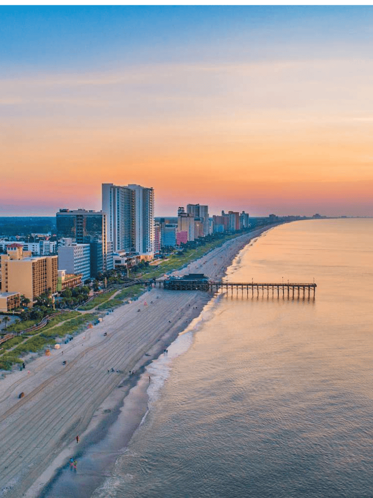 Brighton Beach skyline and pier at sunset in Miami Beach, Florida.