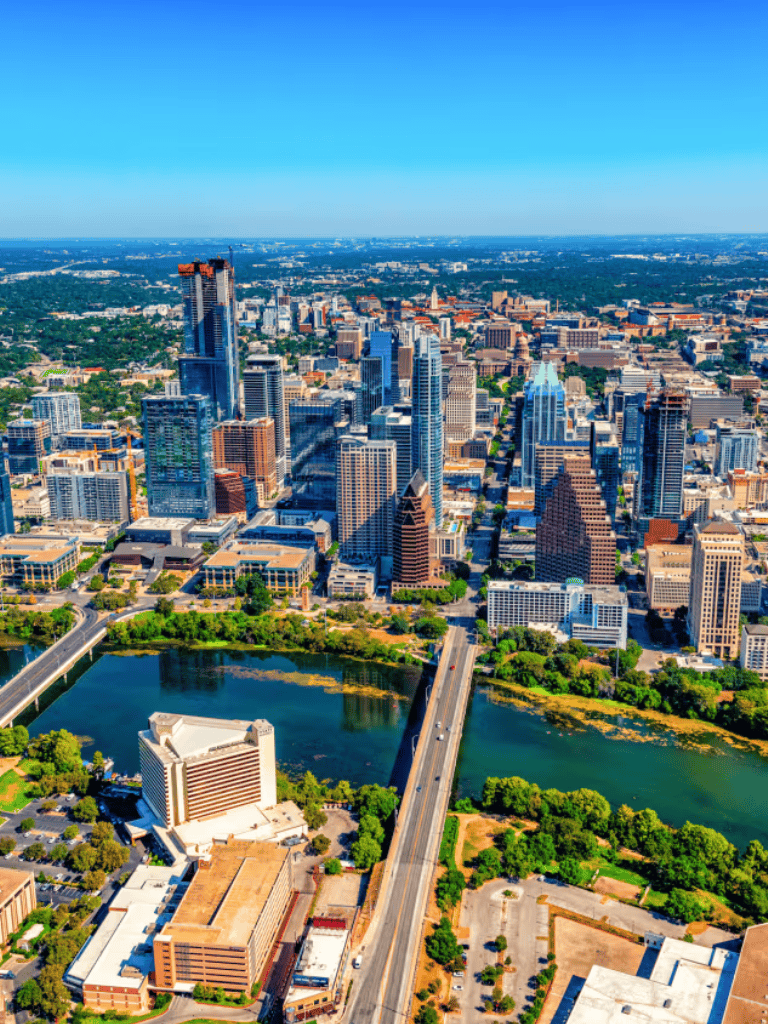 Aerial view of Austin Texas skyline with downtown skyscrapers and Lady Bird Lake.