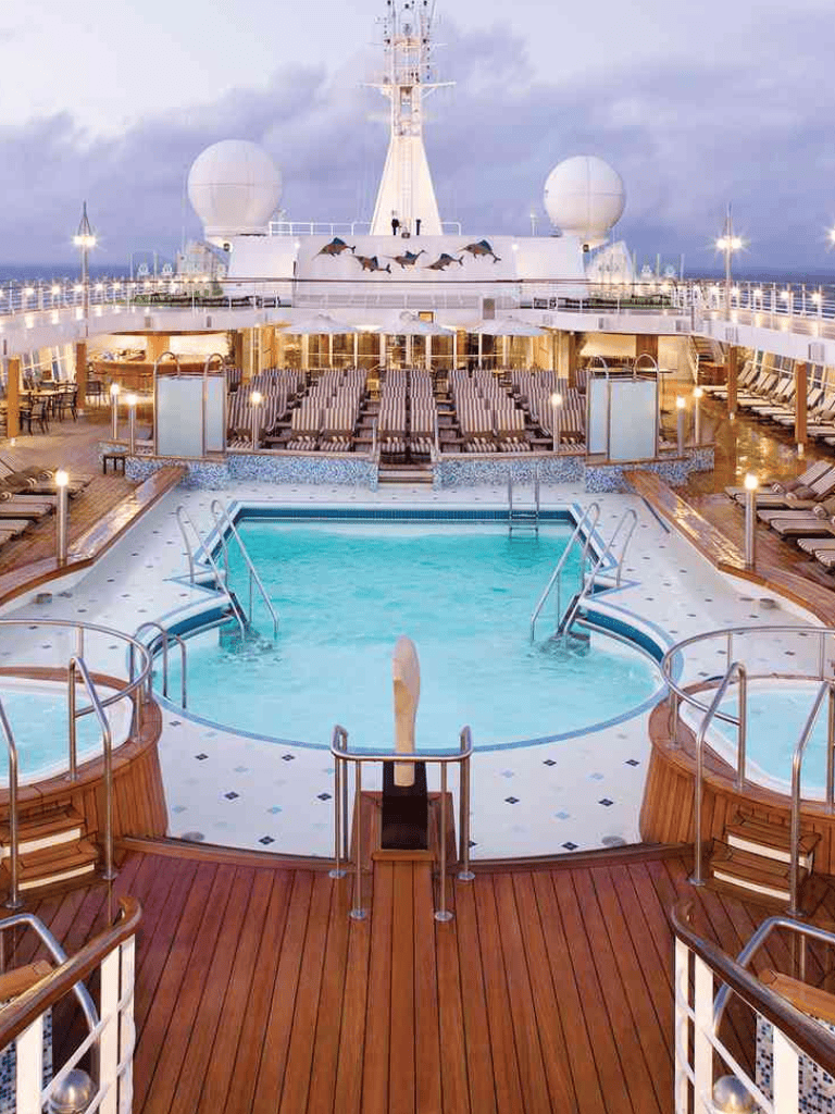 Relaxing cruise ship pool with hot tubs and ocean views. Perfect for leisure and vacation relaxation.