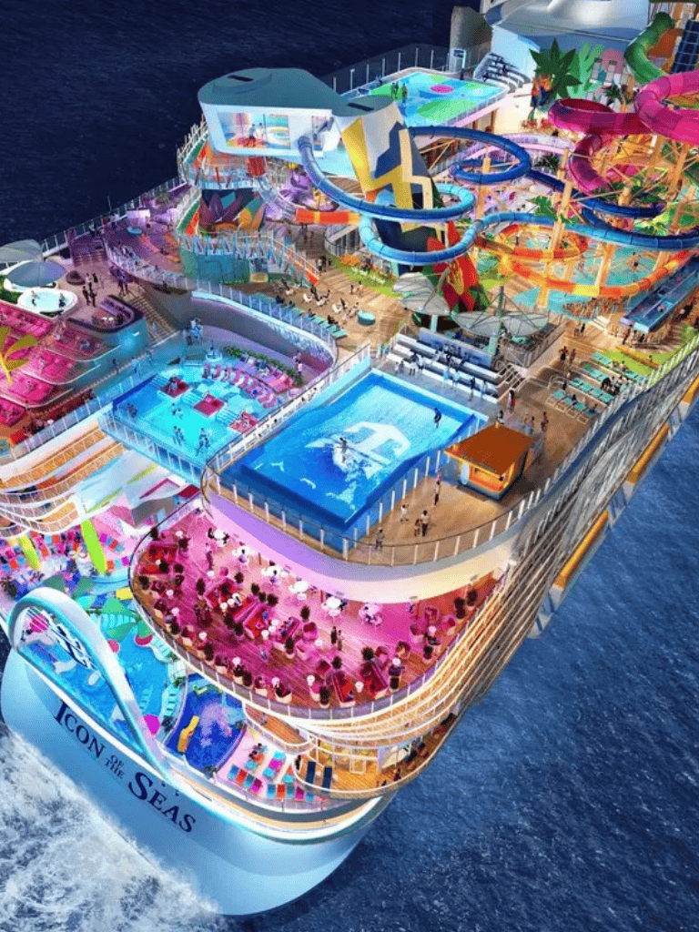 Vibrant cruise ship featuring water slides, pools, and entertainment areas at sea.