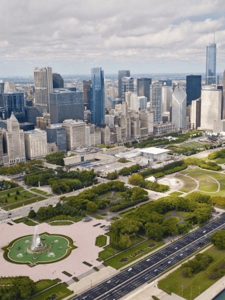 Aerial view of downtown Chicago with Millennium Park and city skyscrapers.