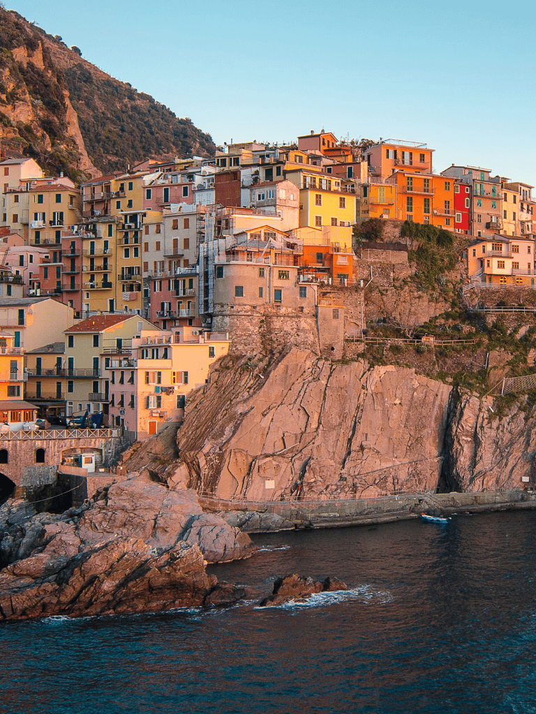 Colorful cliffside village in Cinque Terre, Italy, with vibrant houses overlooking the sea.