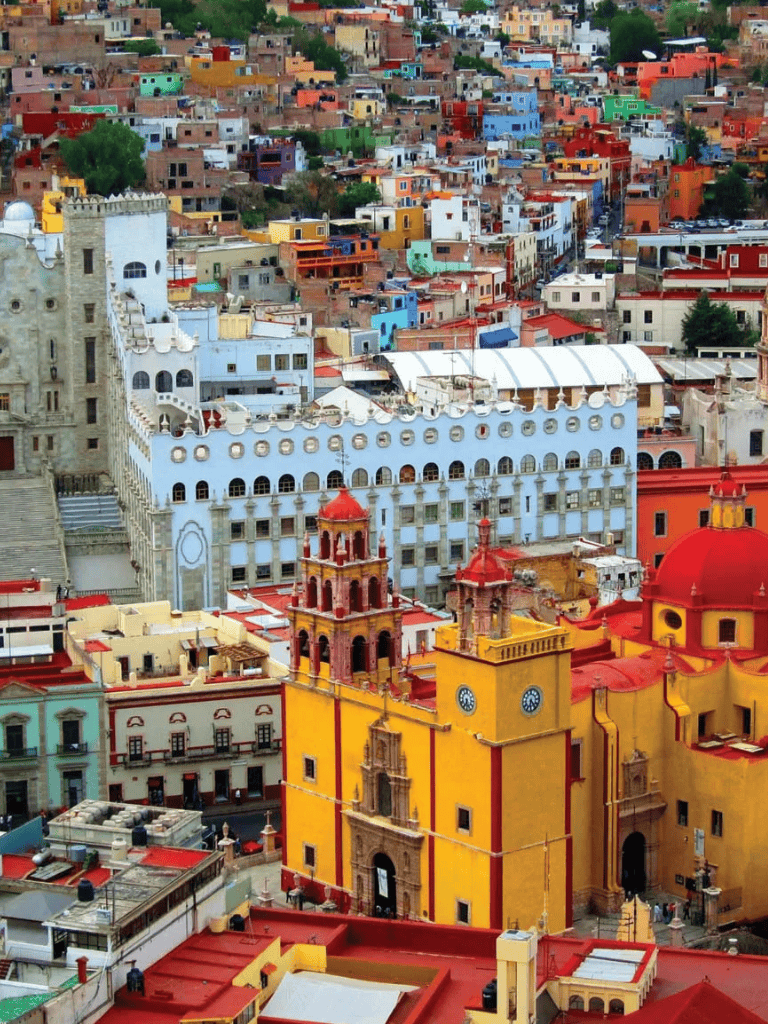 Colorful Mexican cityscape with vibrant buildings and historic architecture.