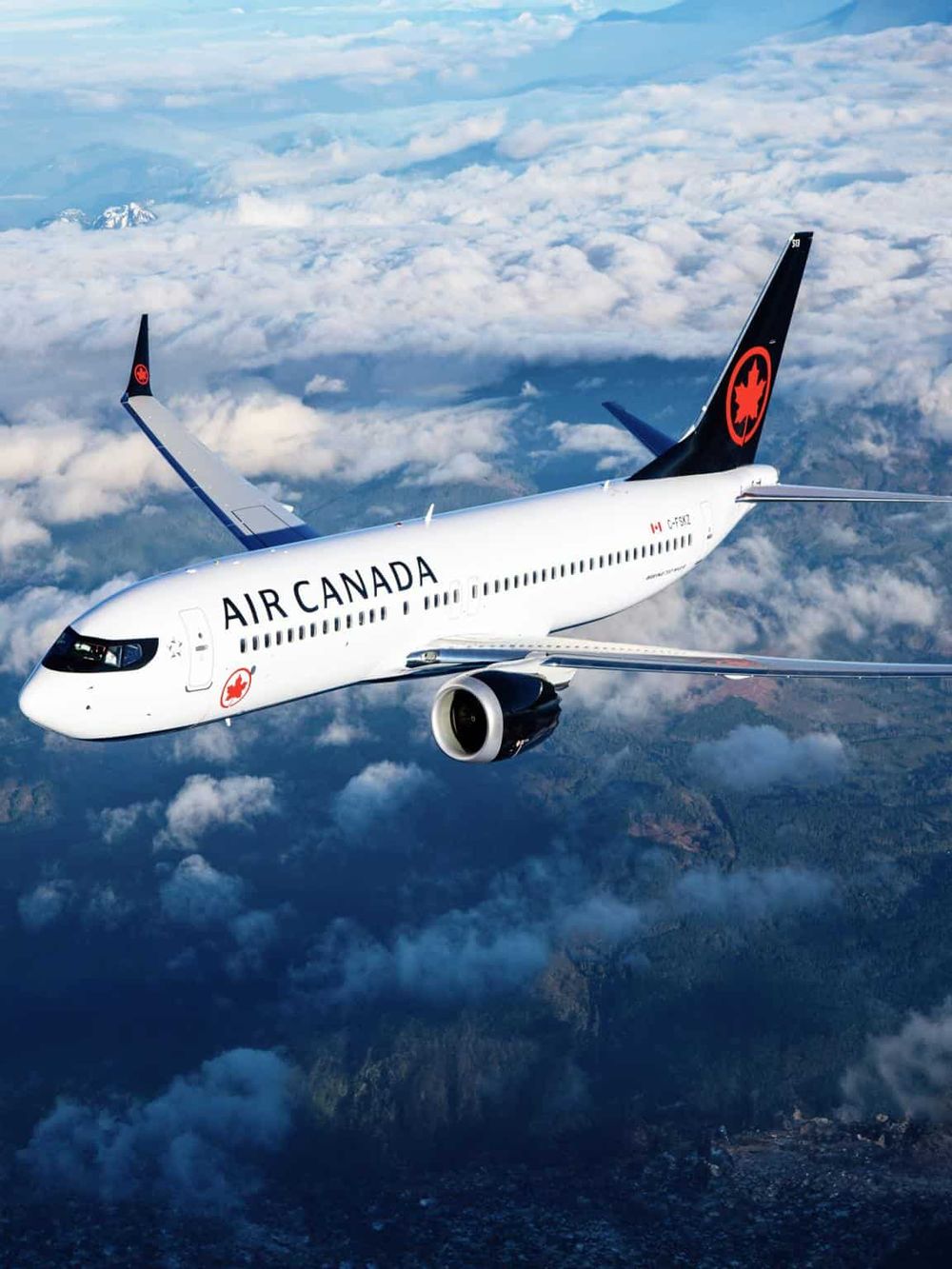Air Canada airplane flying above clouds, scenic view, commercial flight, travel, aviation.