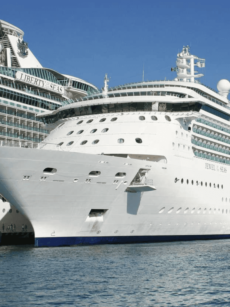 Luxury cruise ship docked at port, Jefferson Seas written on hull, clear blue sky, travel and cruise vacation.