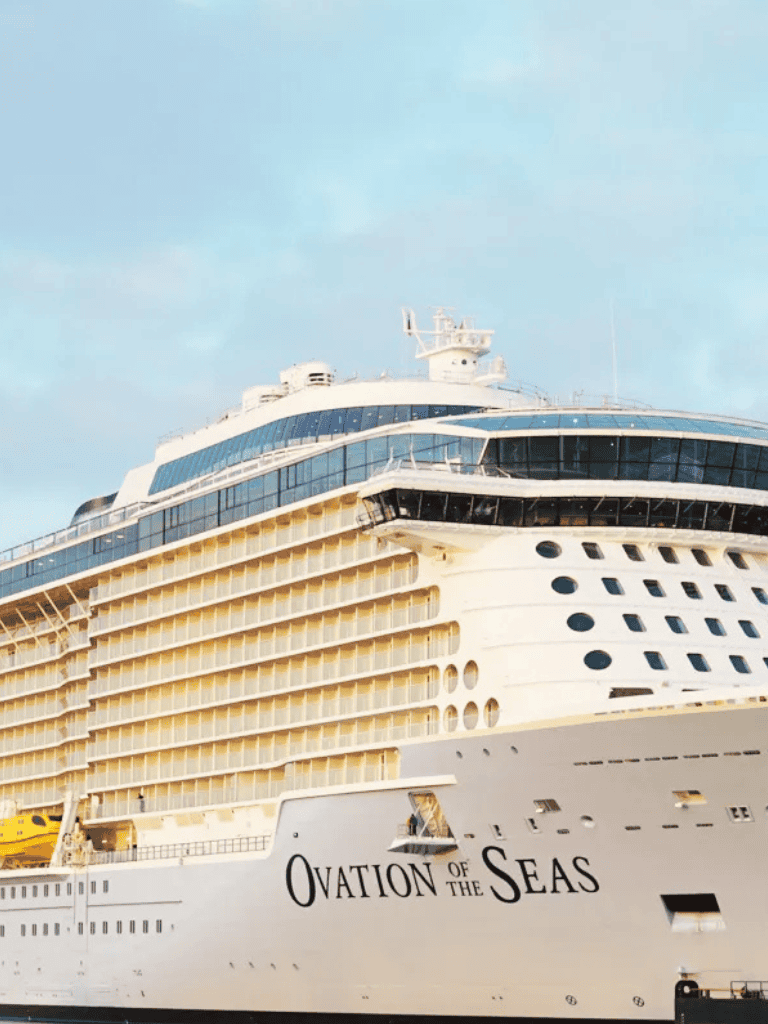 Luxury cruise ship Ovation of the Seas in port, offering world-class travel and ocean adventures.
