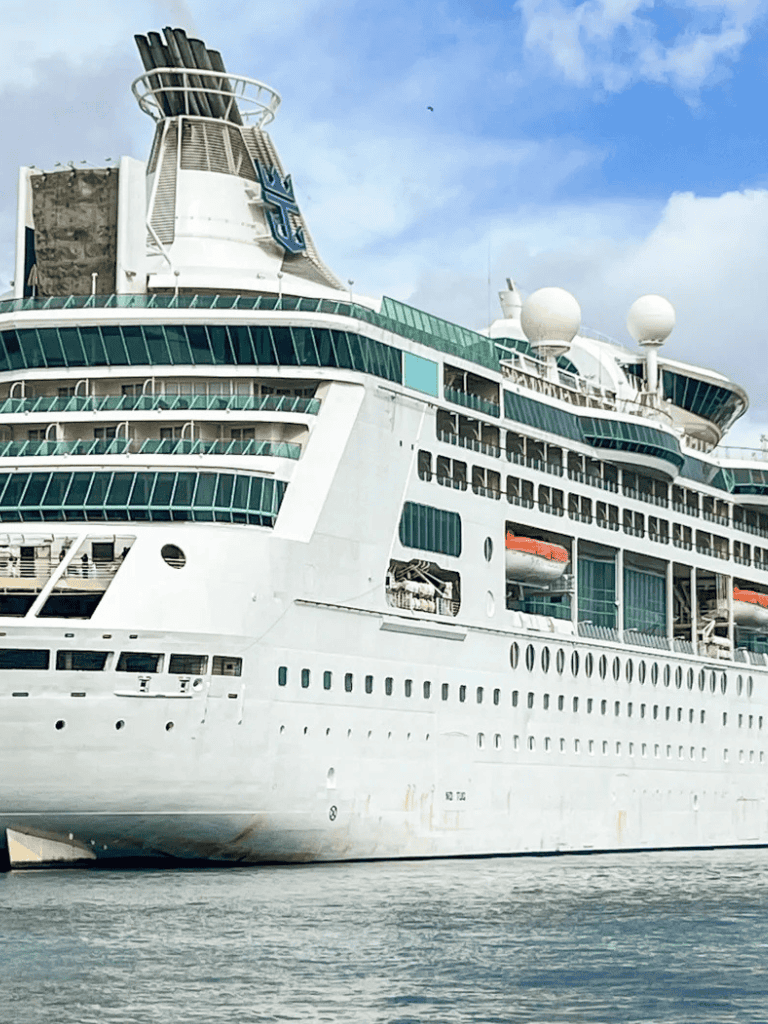 Luxurious cruise ship at sea with modern design and multiple decks.