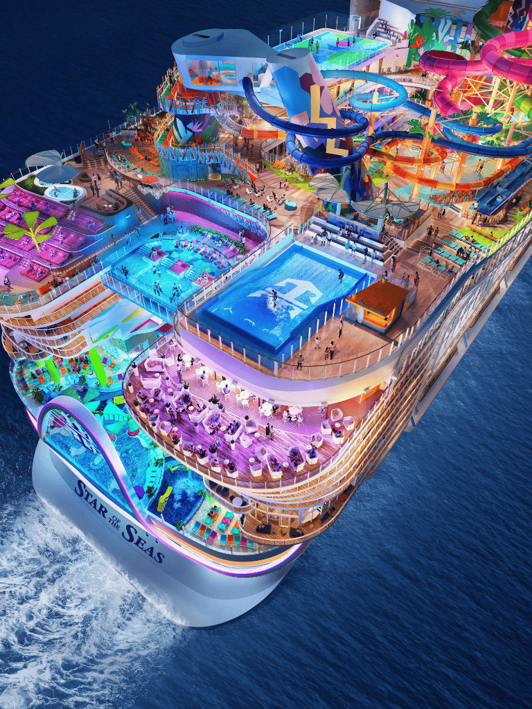 Vibrant cruise ship with water slides, pools, and entertainment on the ocean deck.