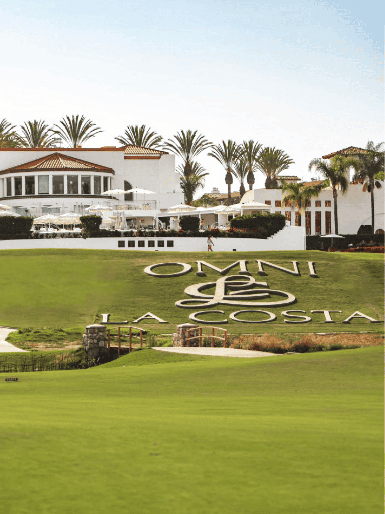 Luxurious La Costa resort with scenic golf course and palm trees in California.