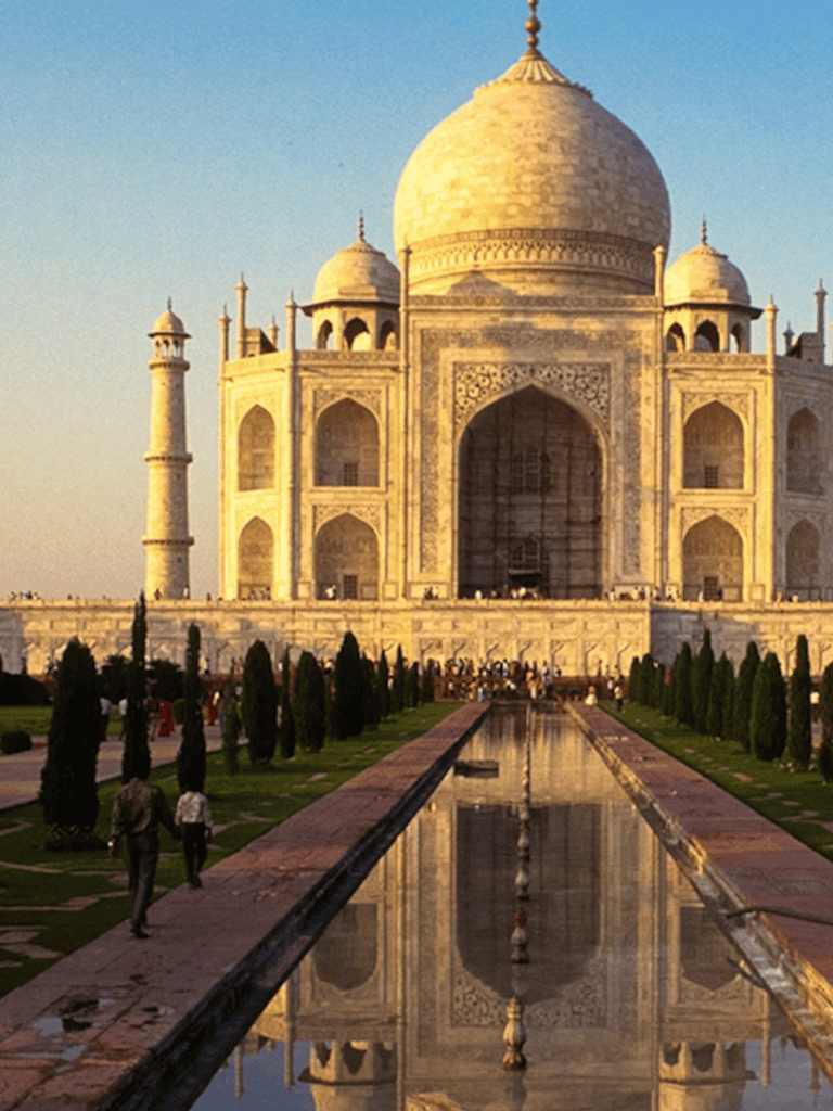Majestic Taj Mahal at sunset, India, iconic monument, world heritage site, travel destination, architectural marvel, tourist attraction.