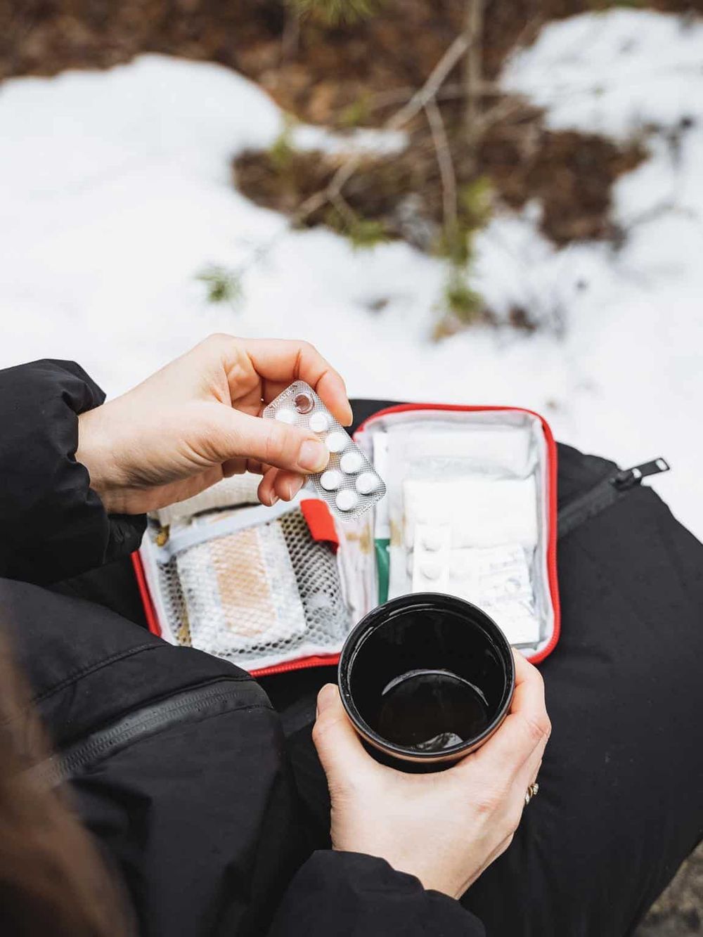 Prescribed medication and water for outdoor adventure or hiking, health, and safety essentials.