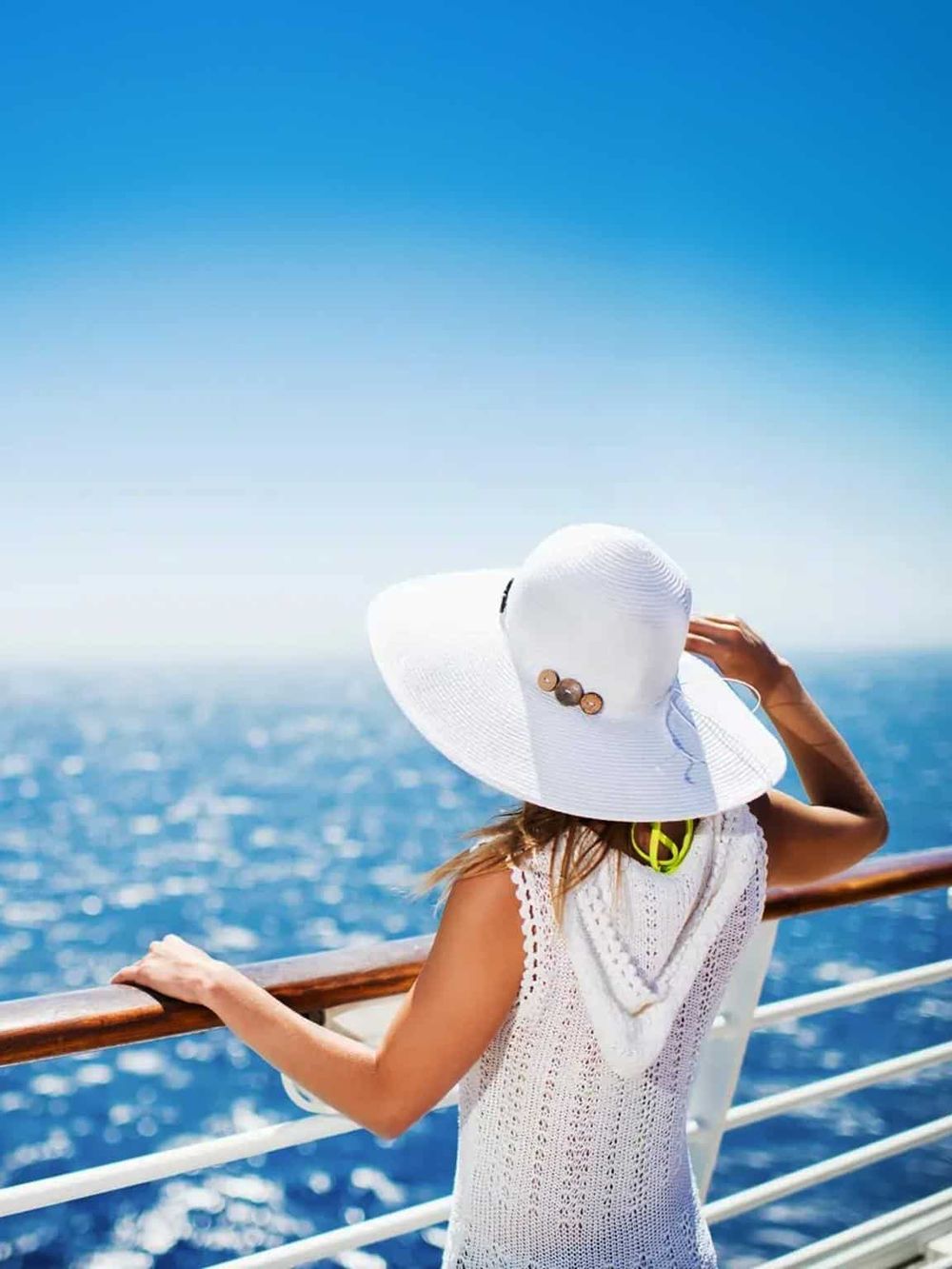 Relaxing on a cruise ship deck with ocean views and sunny skies, enjoying travel adventures and scenic sea vistas.