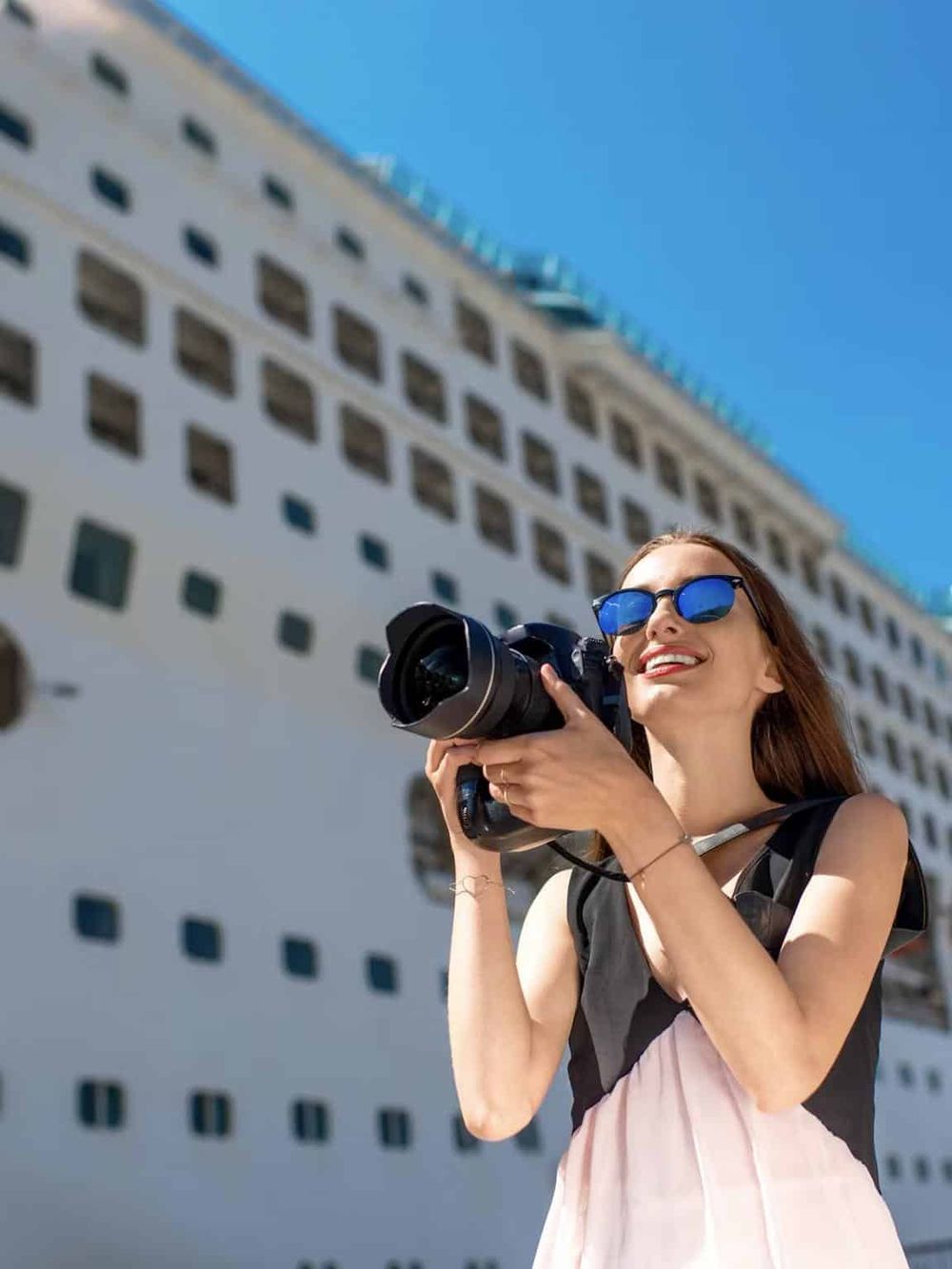Another person on vacation taking photos of buildings in the city, enjoying travel and adventure.