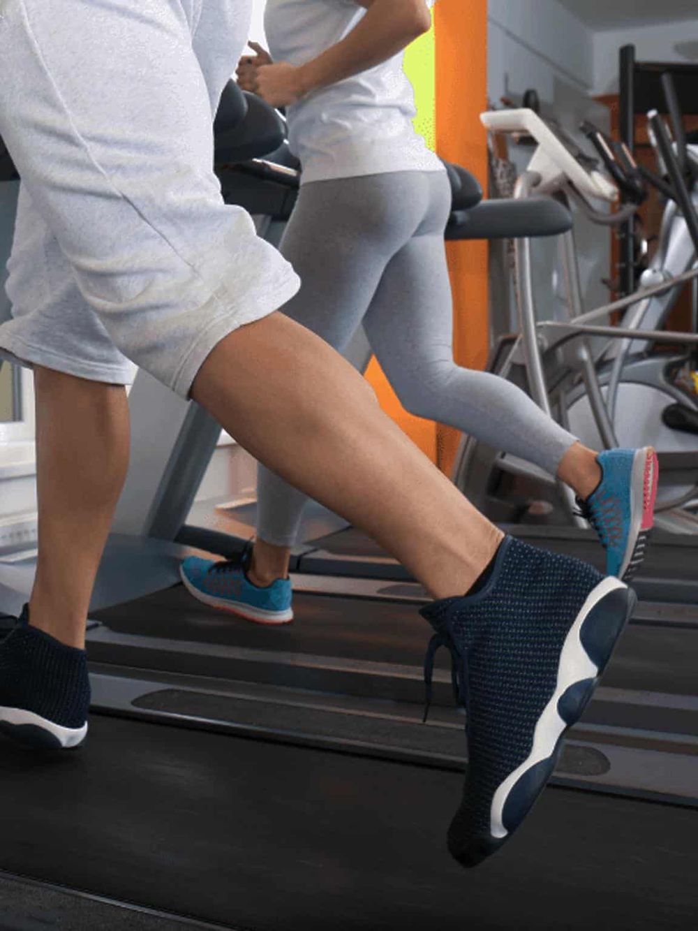 Running on treadmill for fitness and health at gym.