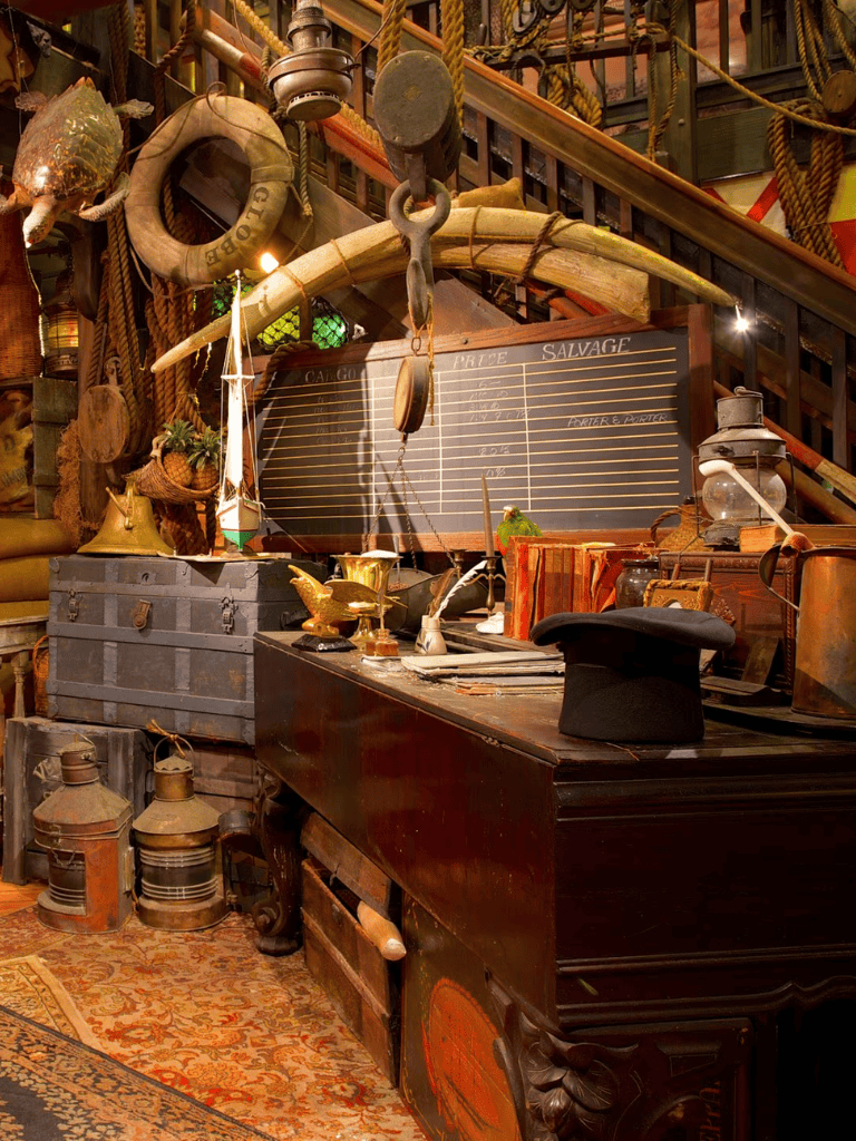 Old nautical shipwreck artifacts with vintage tools and maritime items, creating an antique maritime museum ambiance.