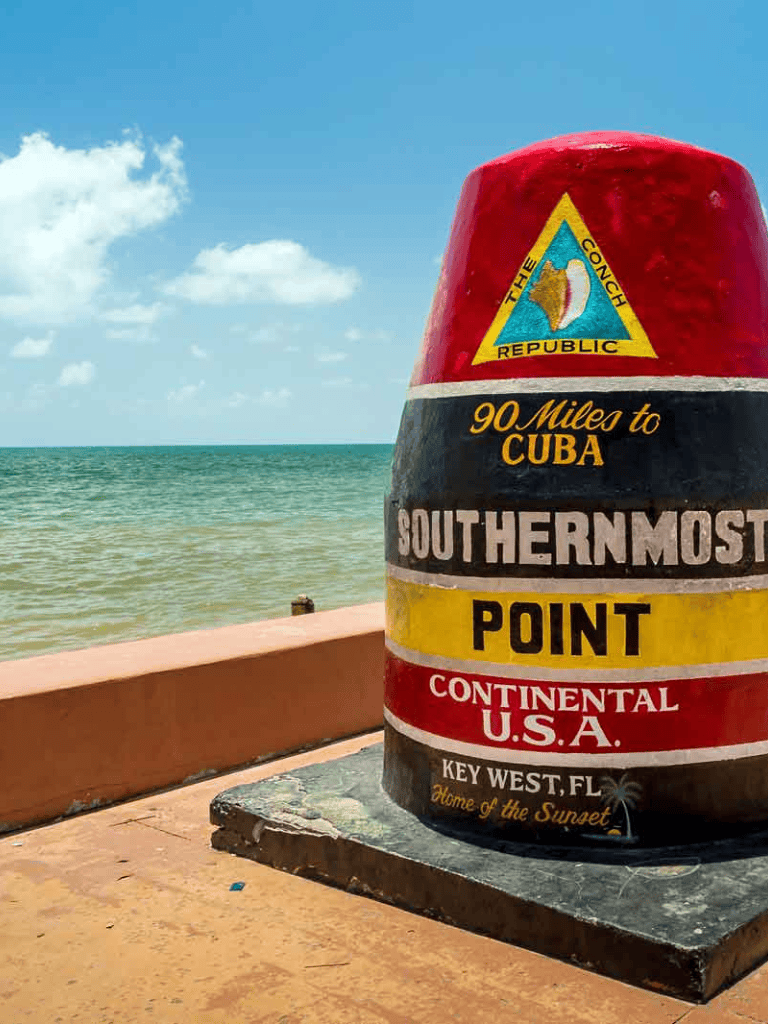 Historical marker at southernmost point of the continental U.S. in Key West, Florida, overlooking the ocean.