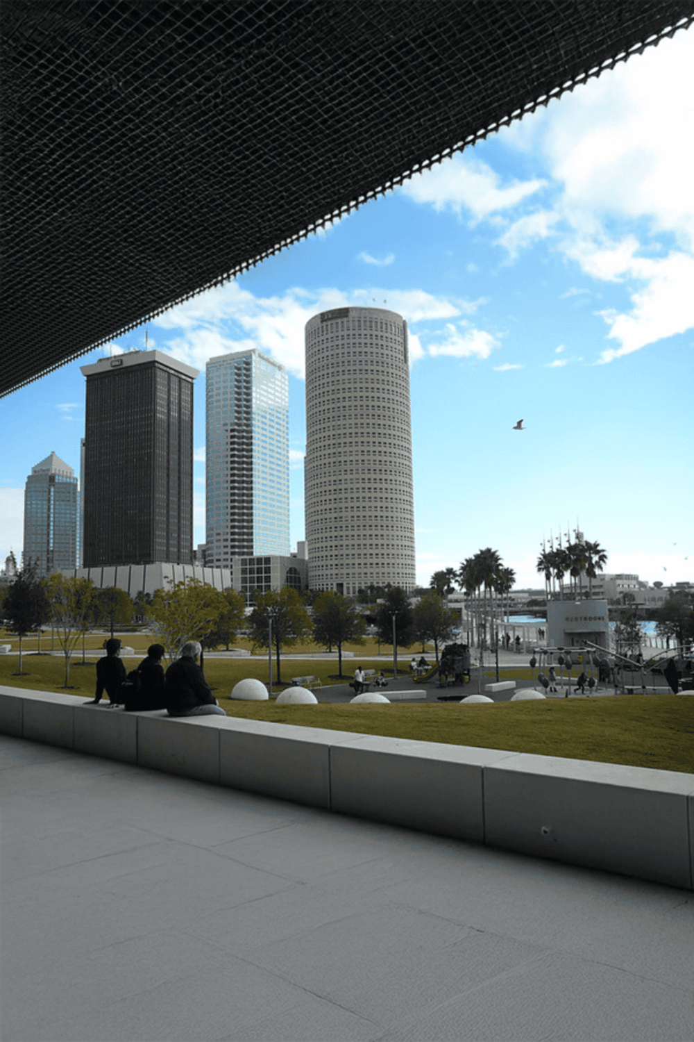 Modern downtown Los Angeles skyline with skyscrapers and blue sky.