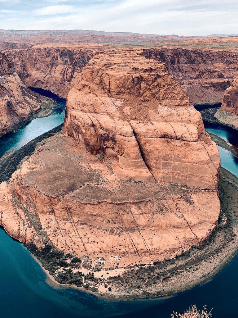 Stunning aerial view of Horseshoe Bend with Colorado River, iconic Southwest Arizona natural landmark.