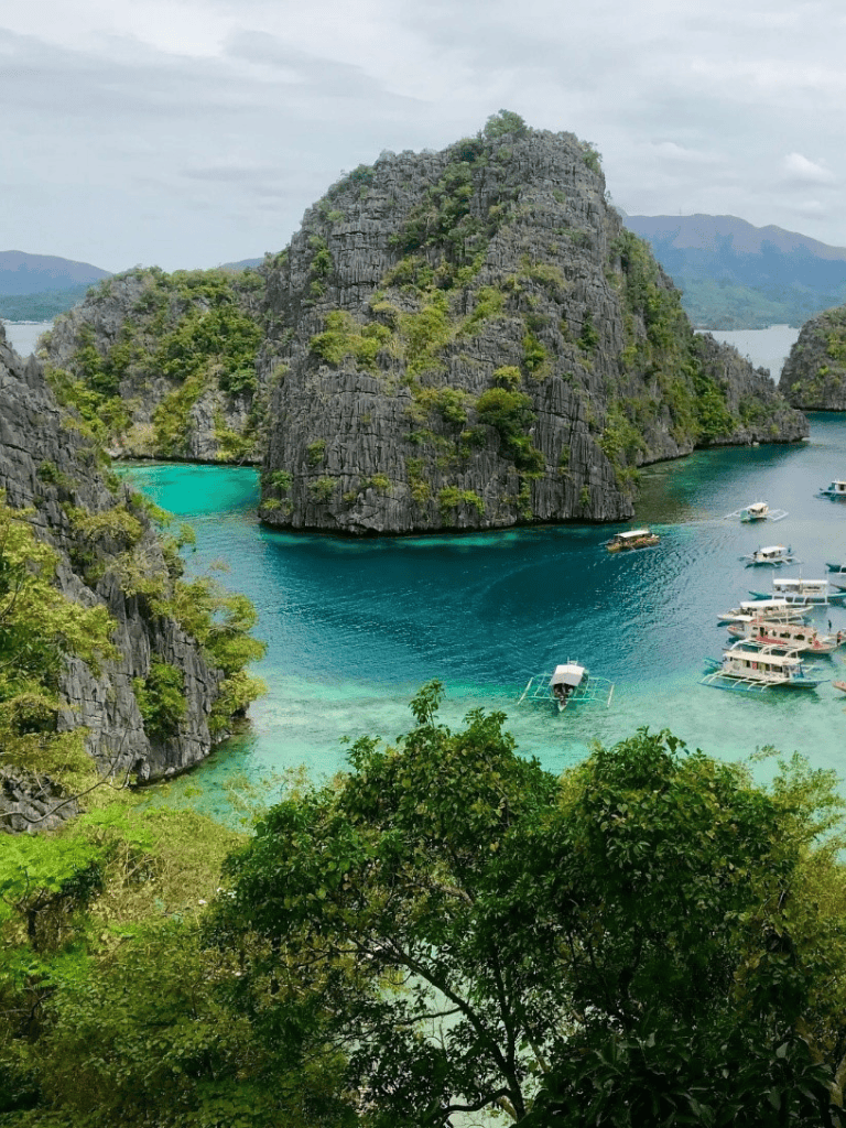 Stunning tropical island with towering limestone cliffs and turquoise waters in the Philippines.