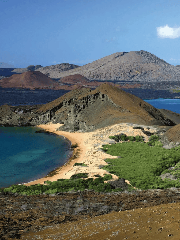 Vulcano island landscape with volcanic craters, sandy beach, and lush greenery, showcasing geological beauty.