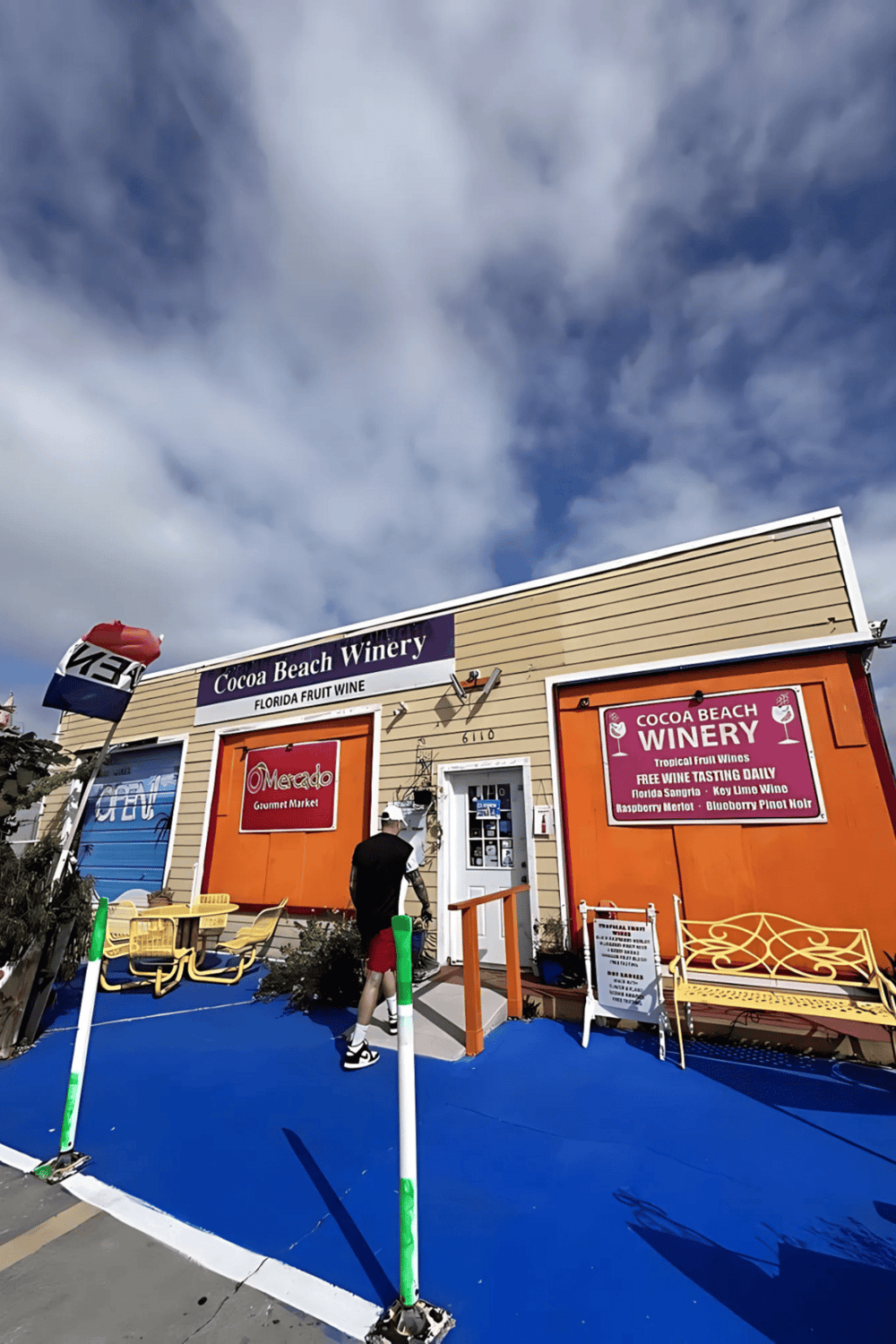 Colorful Cocoa Beach Winery storefront with tropical fruit wines and outdoor seating.