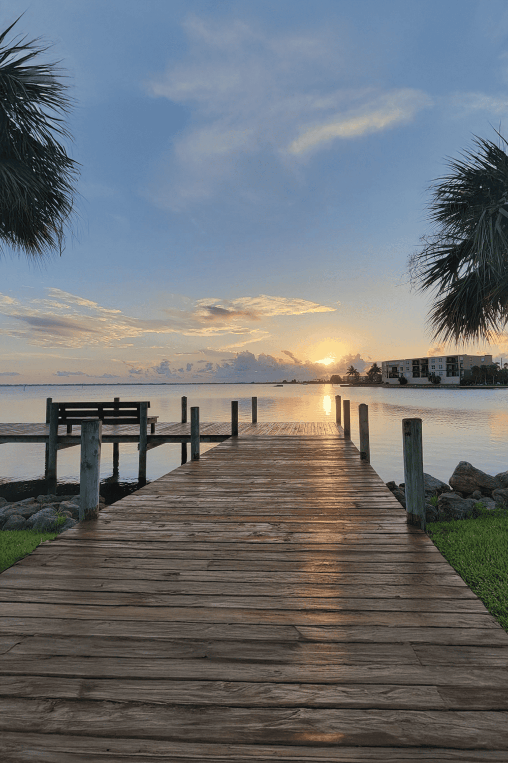 Tranquil waterfront dock at sunset in Florida for relaxing getaways and scenic island views.