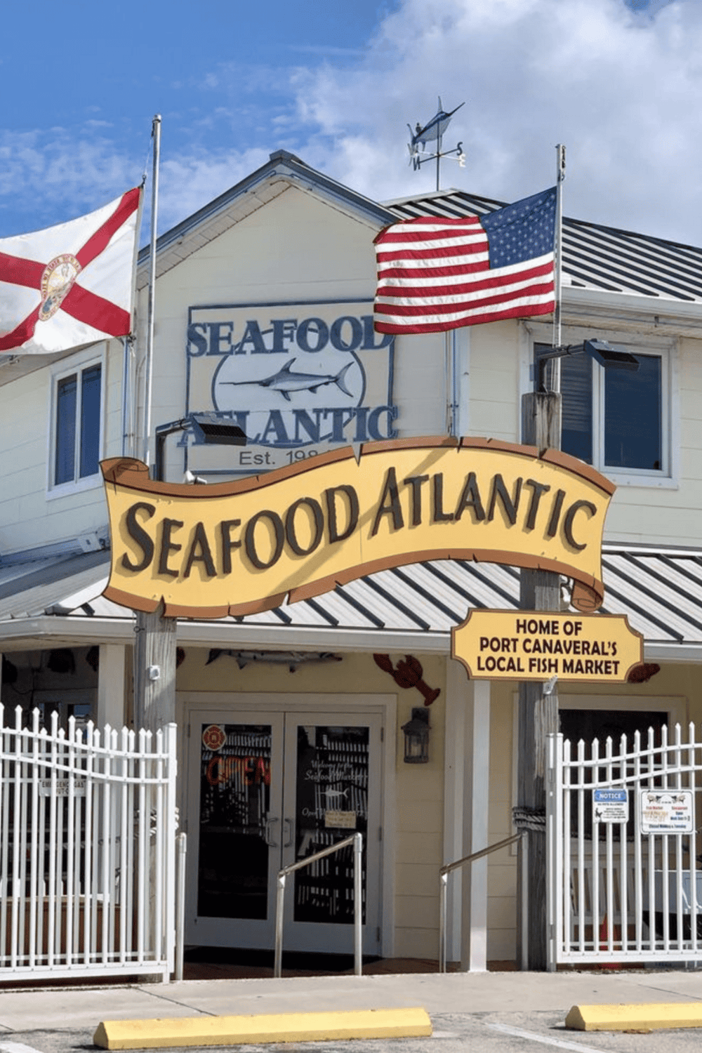 Fresh Seafood Market in Port Canaveral, Florida with American flags outside.
