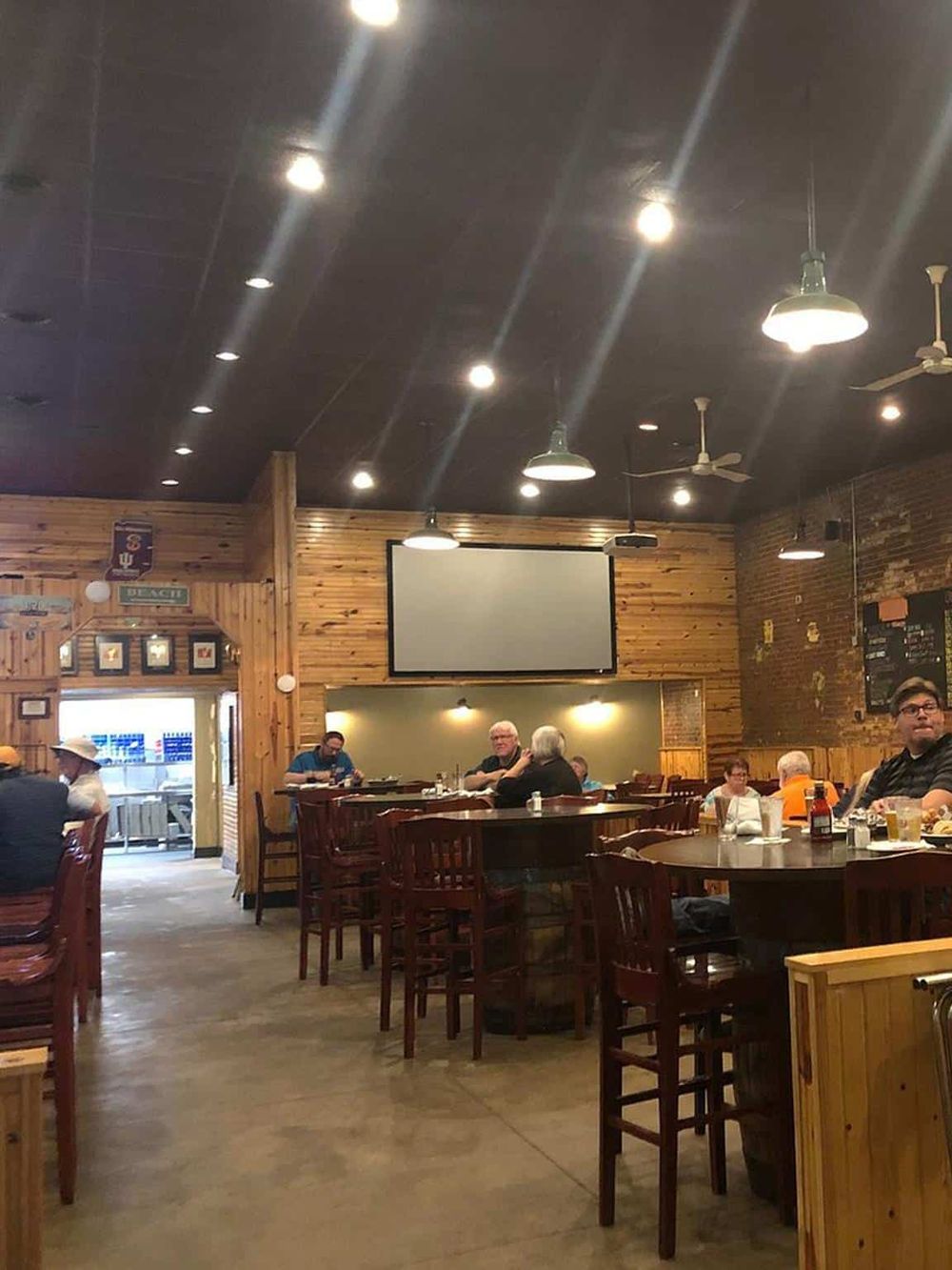 Cozy restaurant interior with wooden accents and casual dining atmosphere for food delivery.