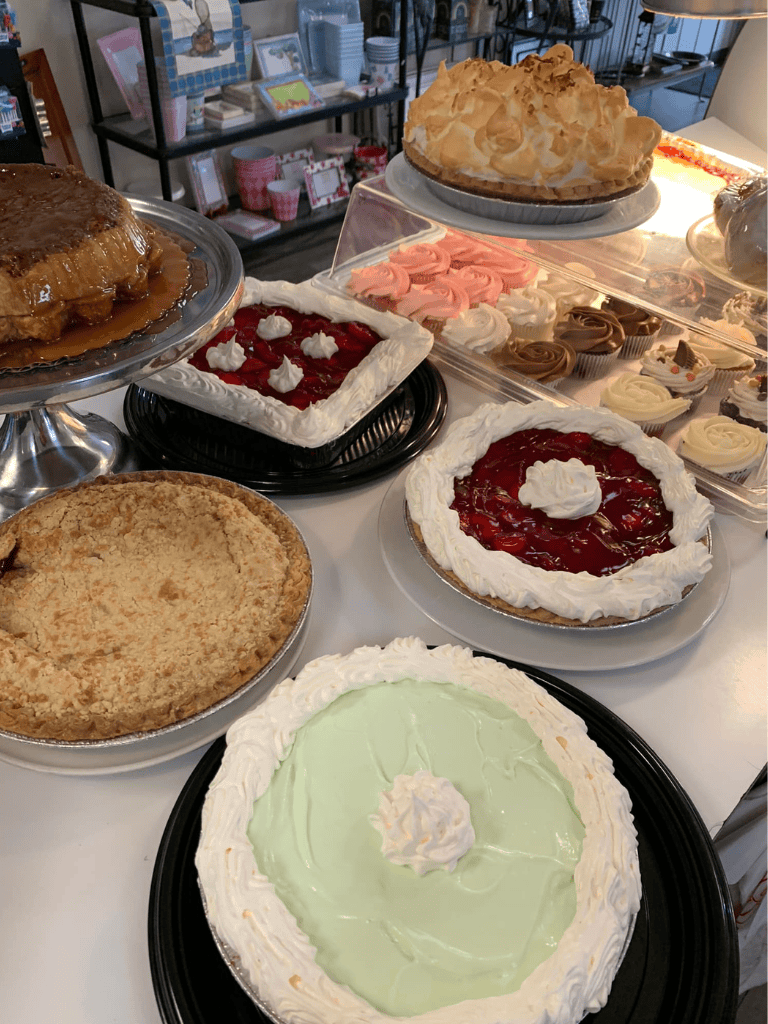 Assorted delicious homemade pies and cakes on display at QuestForDirections.