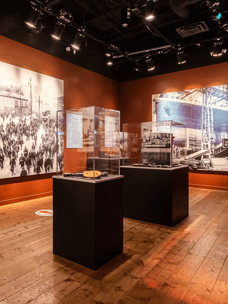 Crowd historic photograph display at museum.
