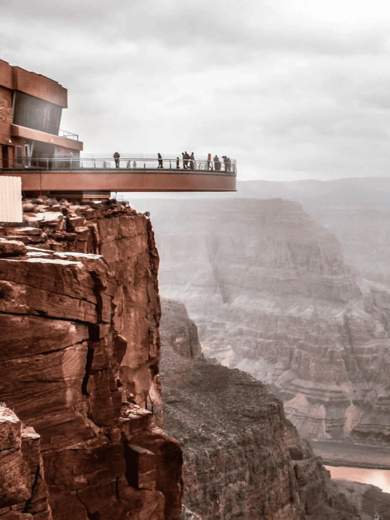 Breathtaking Grand Canyon skywalk with viewing platform over rugged cliffs and scenic valley below.