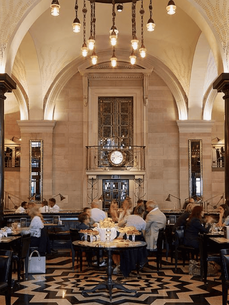 Luxury hotel lobby with grand architecture and elegant decor, perfect for upscale dining.