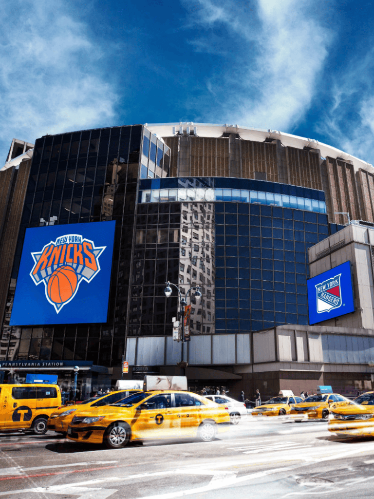 NY Knicks at Pennsylvania Station, New York City downtown, iconic basketball team arena, transportation hub.