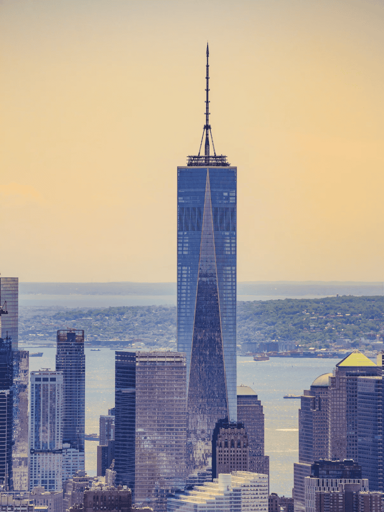 Stunning view of One World Trade Center towering over New York City skyline.