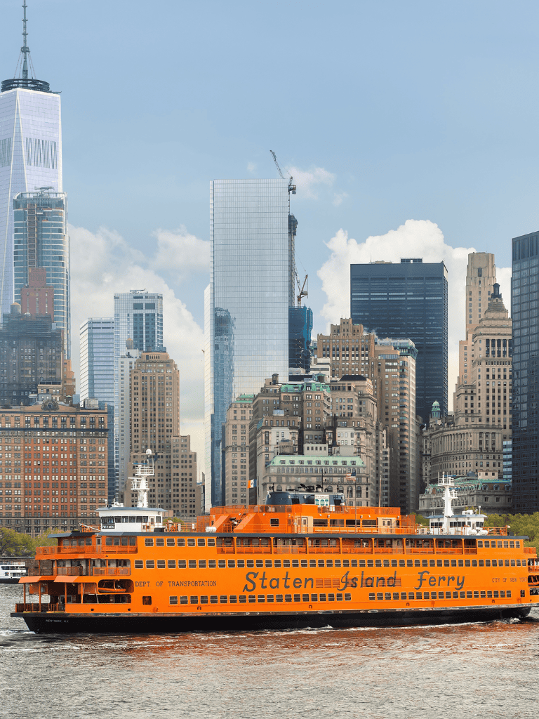 Ferry boat on New York Harbor with Manhattan skyline in background.