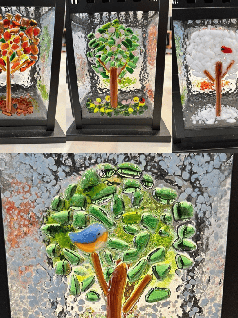 Colorful glass tree artwork with a bluebird, created using fused glass techniques. Unique decorative art piece for home or office.