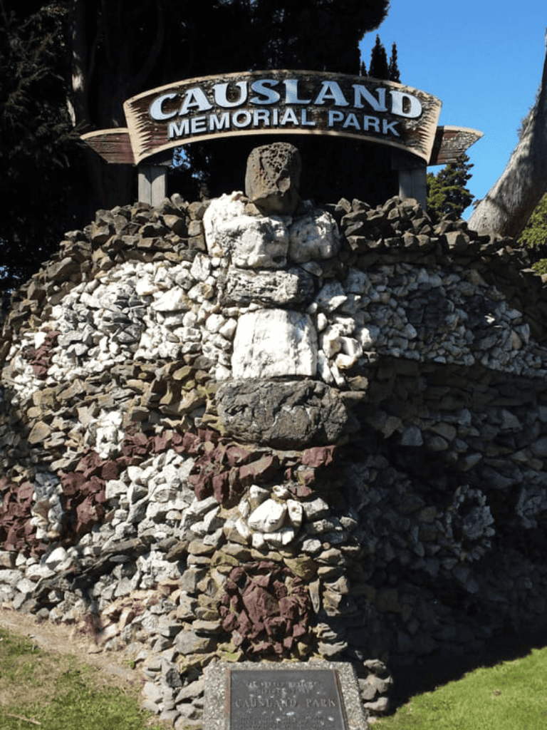 Causland Memorial Park entrance sign made of rocks and stones, scenic outdoor park location.