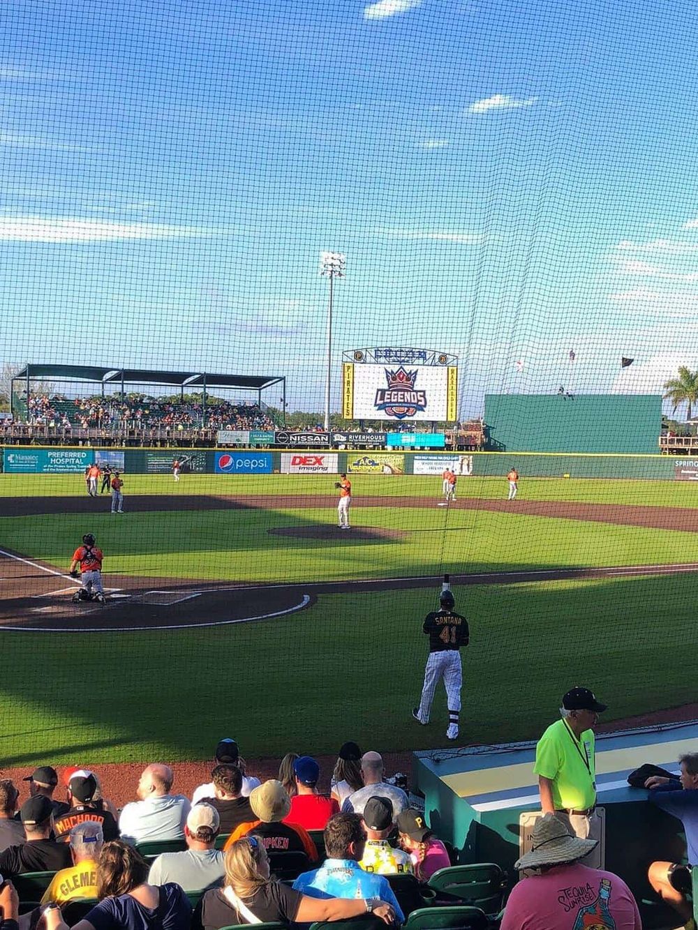 Exciting baseball game at Quest for Directions stadium with fans and players in action.