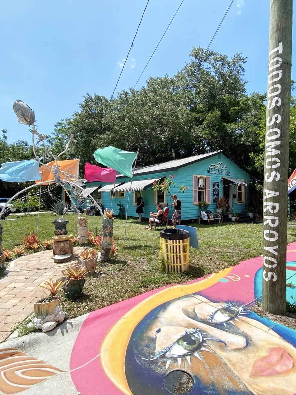 Colorful art and music gallery exterior at Quest for Directions, vibrant outdoor scene and lively community atmosphere.